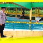 Petugas Kepolisian melakukan olah TKP di Kolam Berenang Desa Saing Rambi, Kecamatan Sambas, Kabupaten Sambas, Minggu (21/6/2026).